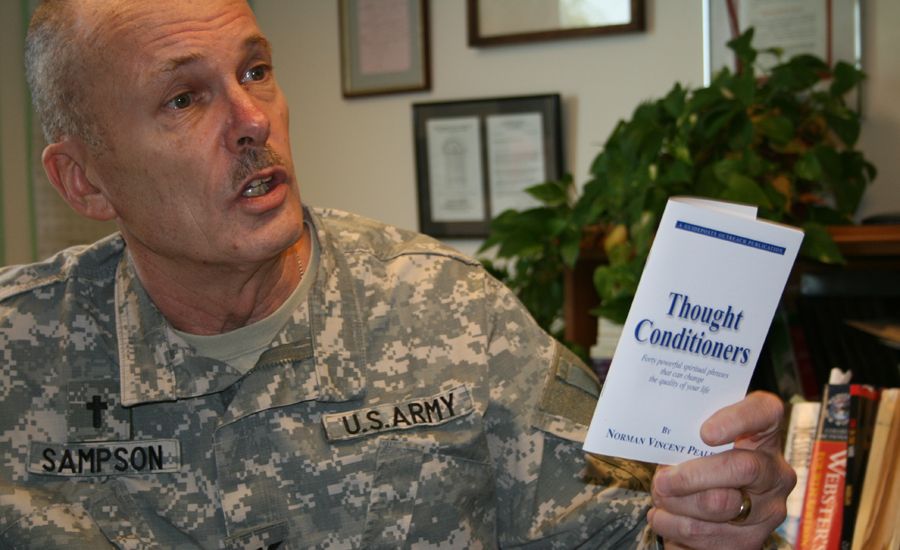 Chaplain Sampson with a Guideposts' Thought Conditioners booklet