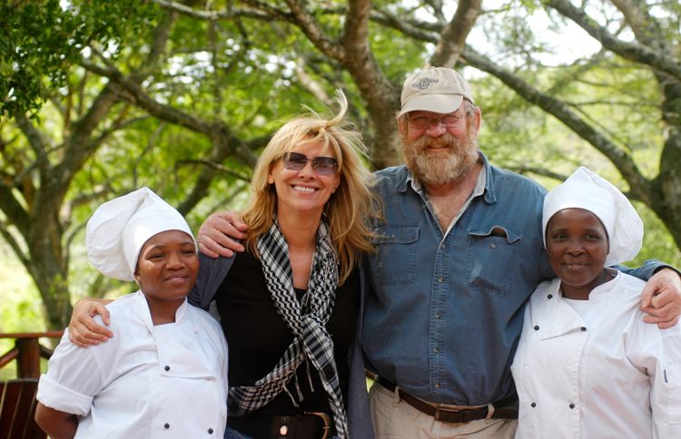 Guideposts: Françoise and Lawrence pose with two of the workers on the game reserve