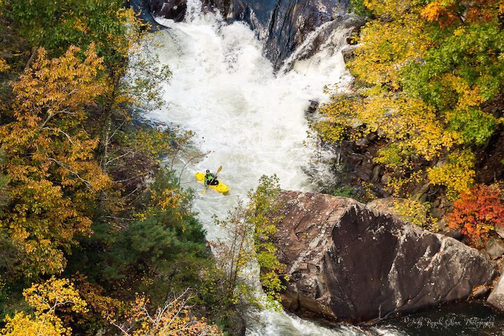 Guideposts: World-class kayakers descend on class 5 rapids during a scheduled water release on the Talullah Gorge, Tallulah Falls, Georgia.