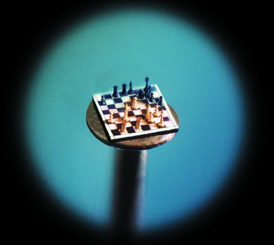 Guideposts: A chessboard—complete with gold chessmen—on the head of a pin