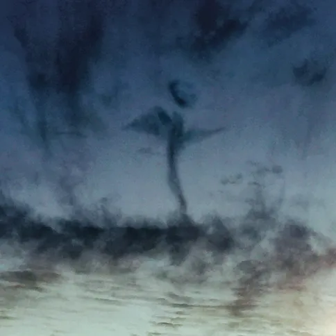 Guideposts: An angel appears in the clouds at twilight over Northport, Alabama