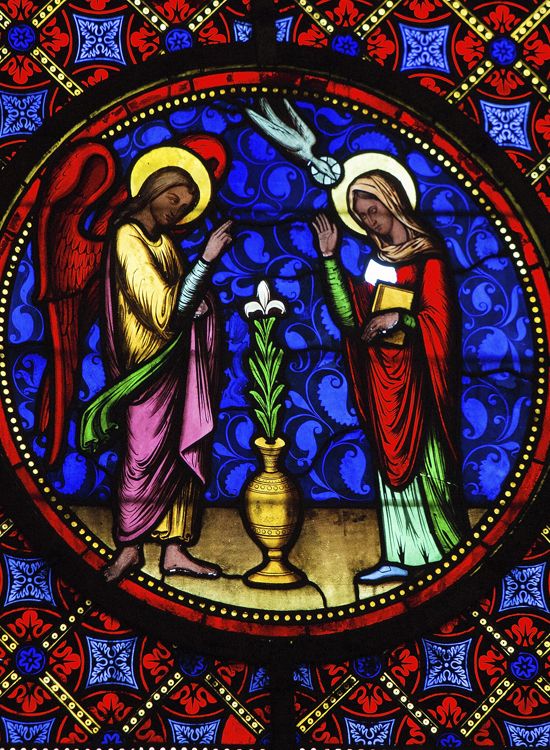 stained glass image of the annunciation of Christ's Immaculate Conception to Mary