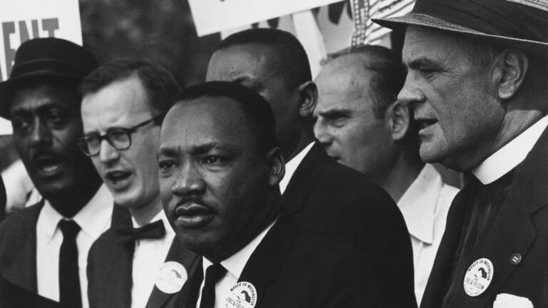 Martin Luther King saying a prayer at the March on Washington