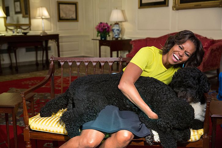 Guideposts: Michelle Obama hugs Bo and Sunny in the White House