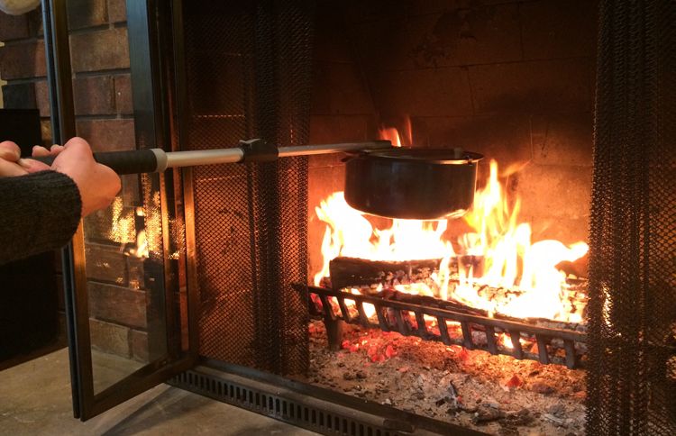 Guideposts: A long-handled popcorn popper is held out over the flames of a fireplace