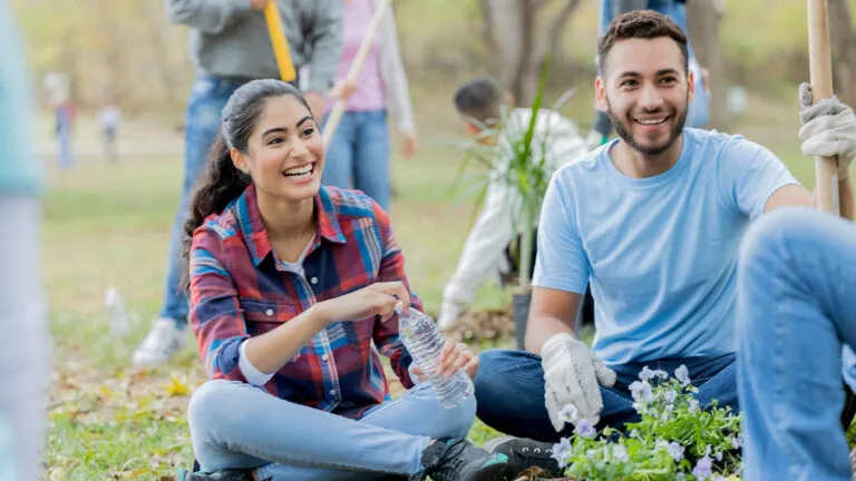 Young couple volunteers as an act of kindness outside for Easter