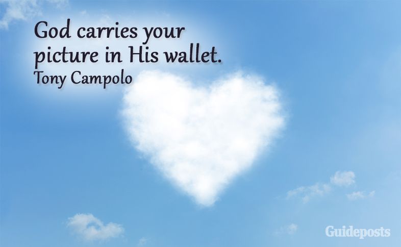 A heart-shaped cloud in the sky with a quote saying God carries your picture in His wallet.