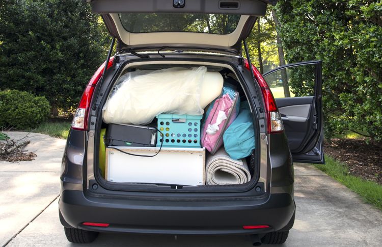 Guideposts: An open hatchback reveals a car packed with a college student's possessions