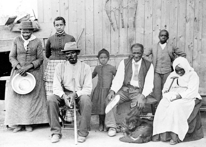 Guideposts: Harriet Tubman (far left) with family and neighbors, circa 1887, at her home in Auburn, NY.