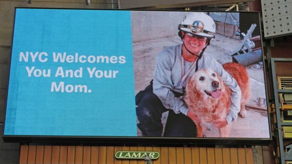 Billboard in Times Square honoring Bretagne the dog and her handler, Denise Corliss. Photo by BarkPost.