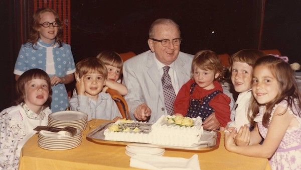 Norman Vincent Peale surrounded by his grandchildren on his 75th birthday.