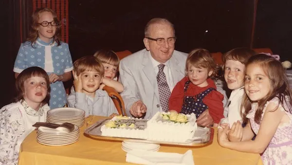 Norman Vincent Peale surrounded by his grandchildren on his 75th birthday.