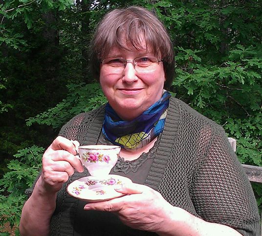 Series author Susan Page Davis, who conceived of the Tearoom  Mysteries series, poses with a teacup that belonged to her mother.