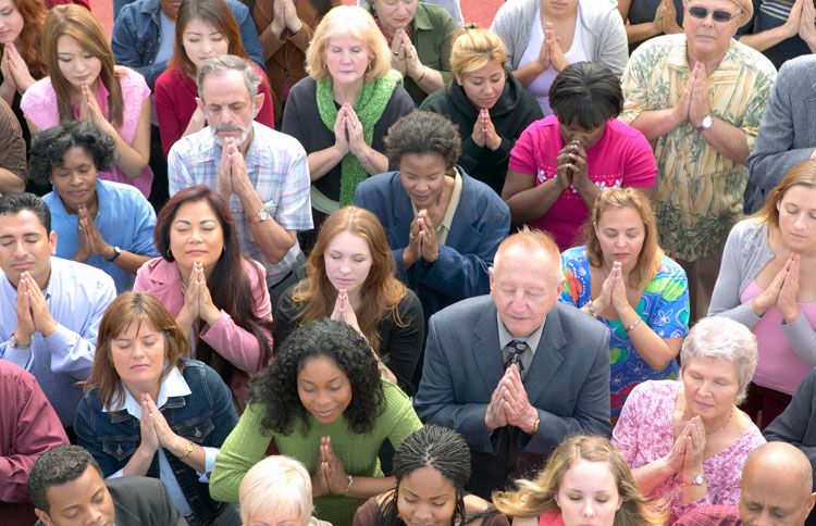 A group of people praying