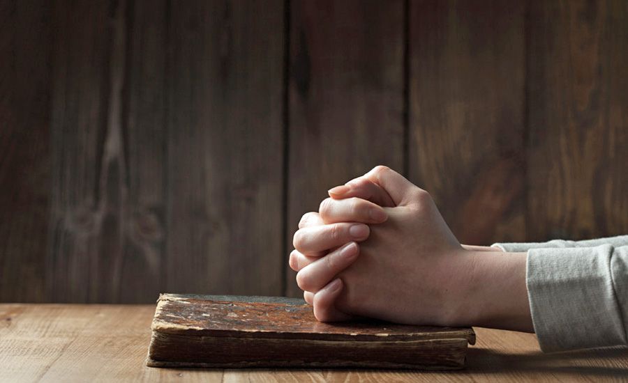 Woman's hands praying
