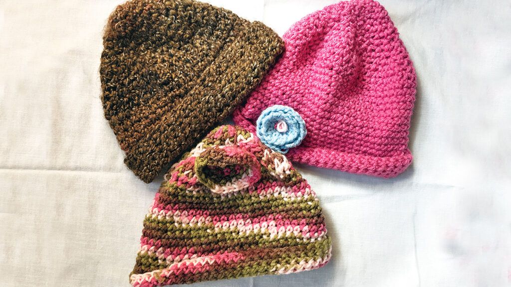 Three of Mary's crocheted caps