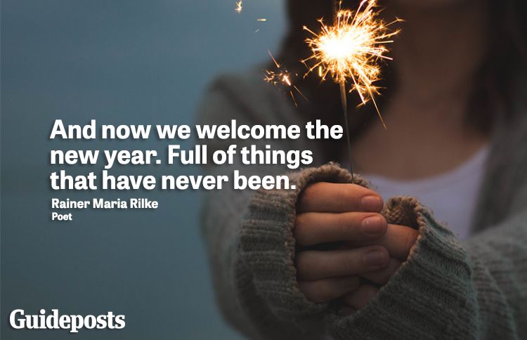 Girl holding sparkler with New Year quote about new beginnings