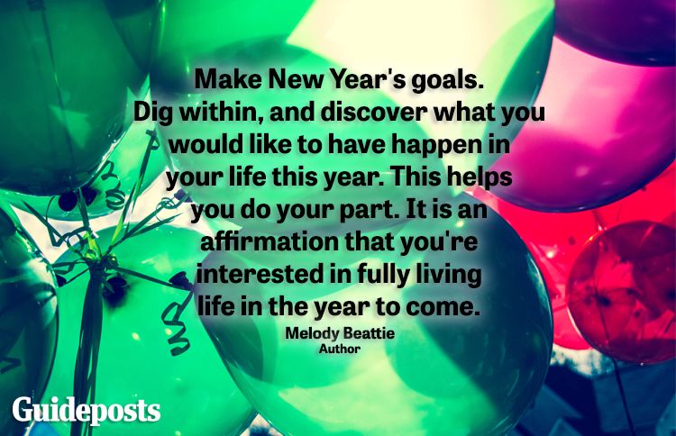 Close up of colorful balloons with new year quote about goals