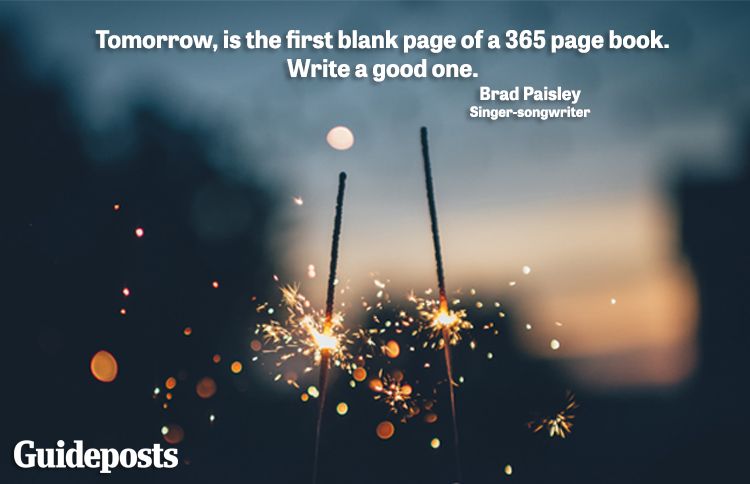 Two firework sparklers held by two people with new year quote about starting over