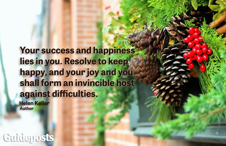 Holiday decorative pinecones with holly with new year quote about success