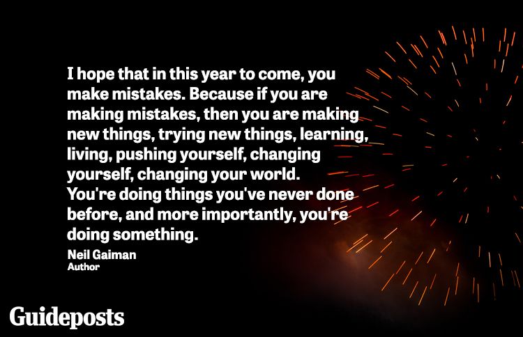 Dim firework exploding in the midnight sky with new year quote about trying new things