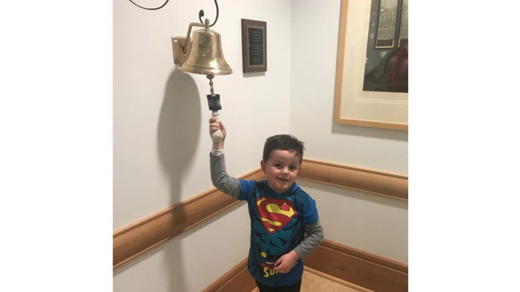 Jimmy Spagnolo, 6, rings a bell to signify the end of his cancer treatments at the Children’s Hospital of Pittsburgh.