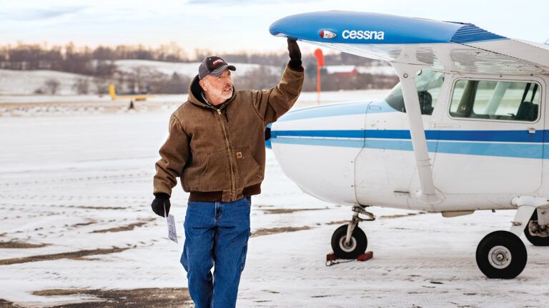 Joe conducts a preflight check of a Cessna 172.