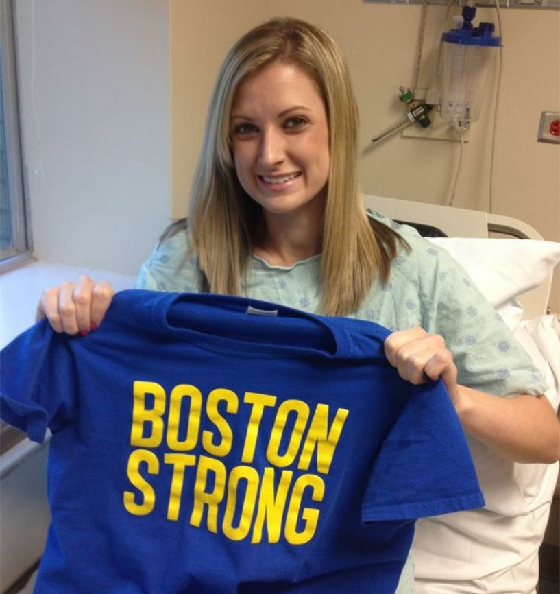 Rebekah Gregory shows off her Boston Strong t-shirt from her hospital bed