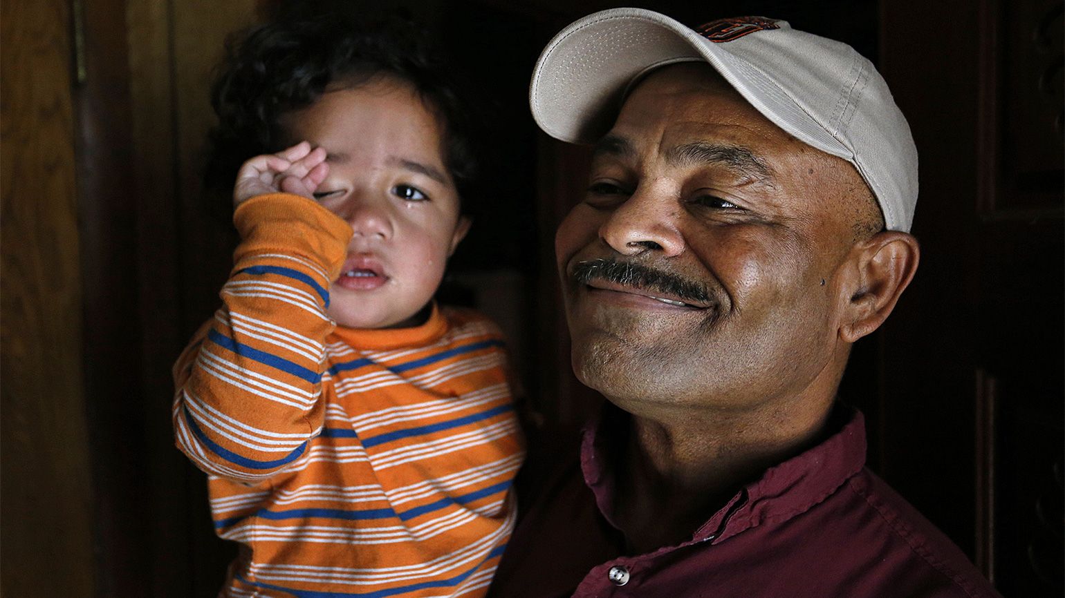 Iraq Veteran's Journey of Healing: Powell holds his two-year-old grandson, Ezekiel Marshall.