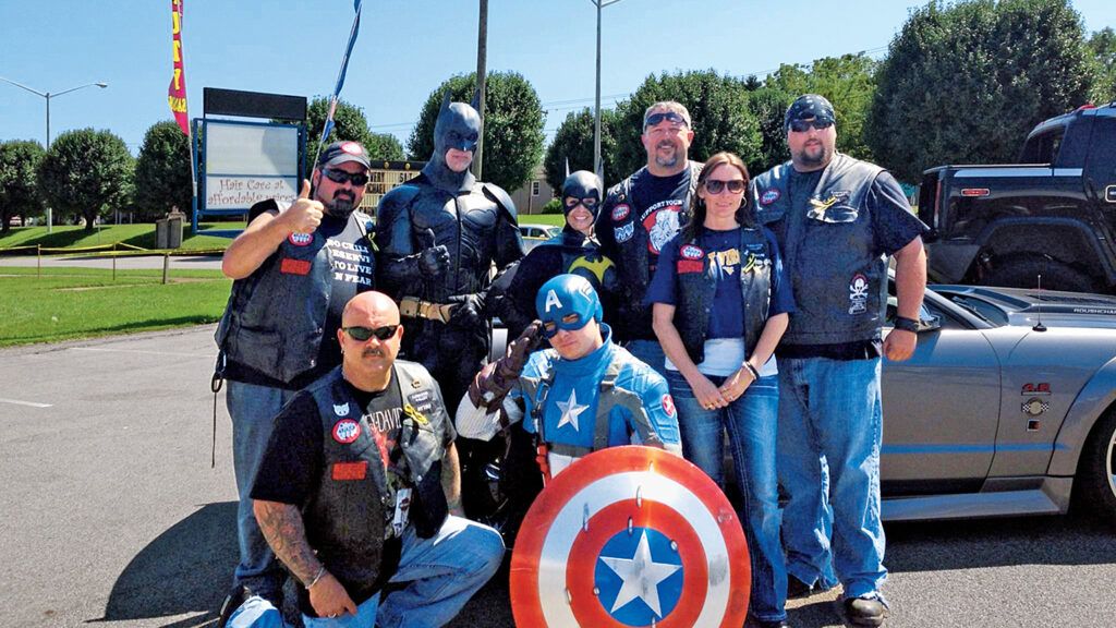 Troy, John and John’s wife, Ronda, with Bikers Against Child Abuse
