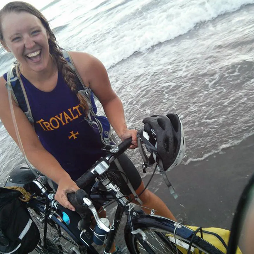 Deborah celebrates the end of her journey by enjoying a splash in the Pacific Ocean on the Oregon Coast.