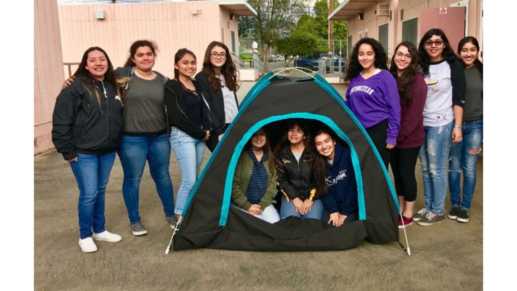 San Fernando High School girls around their invention
