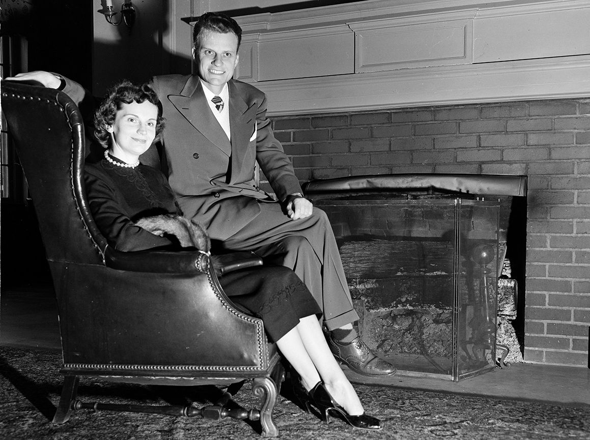 Graham and his wife, Ruth, sit by the fireplace at the Carolina Inn in Chapel Hill, North Carolina, in a photograph taken on February 8, 1951.