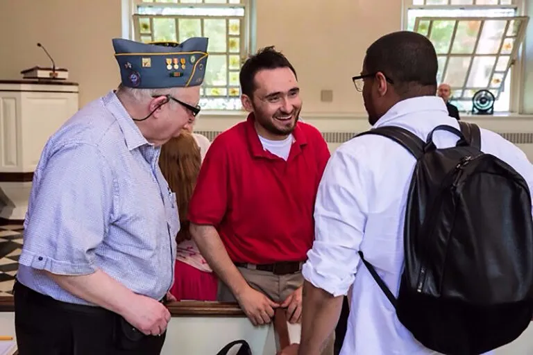 Steven greets a pair of military veterans in attendance at one of his band's performances