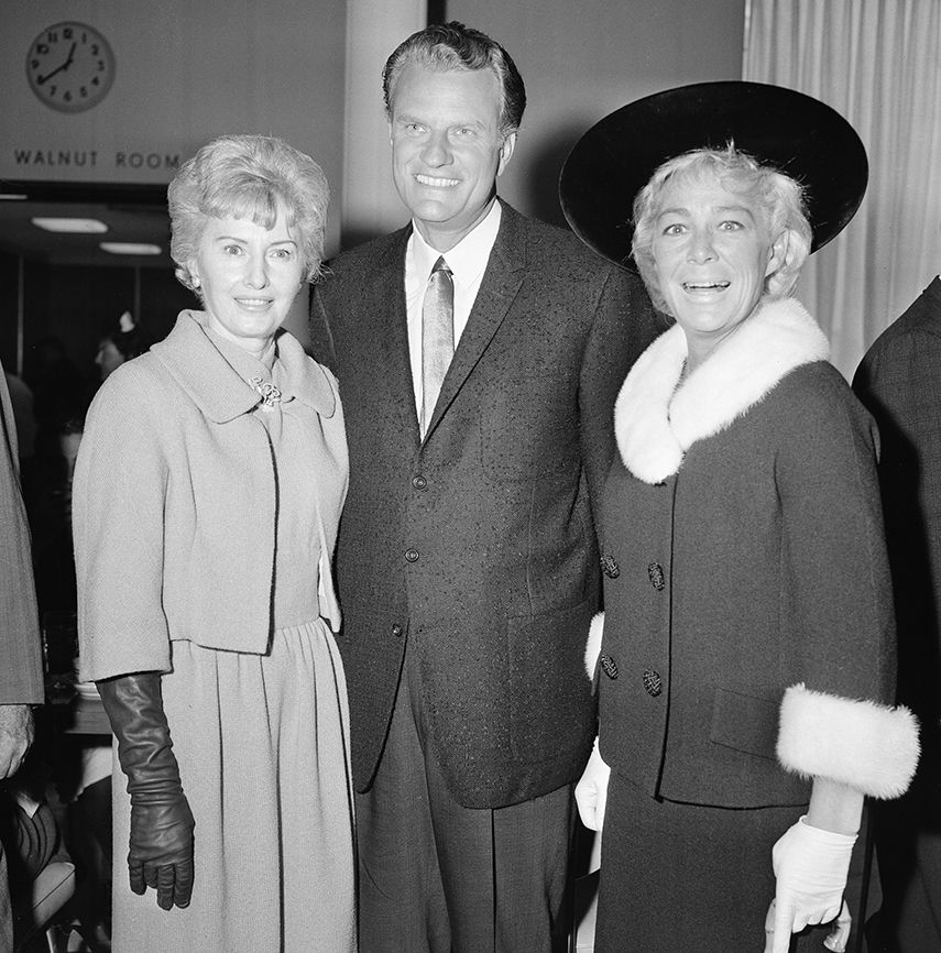 Graham poses with actresses Barbara Stanwyck (left) and Betty Hutton during a visit to Hollywood, California, on September 19, 1963.