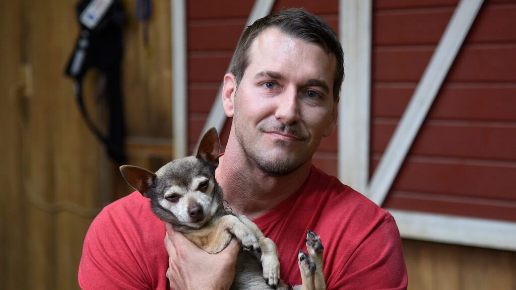 Lucky Dog host Brandon McMillan and a canine friend