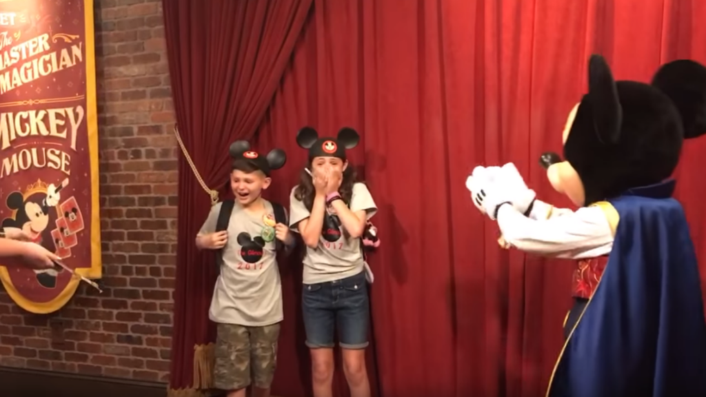 Watch Mickey Mouse Tell These Two Kids They've Been Adopted