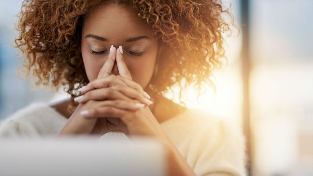 Woman Praying - CEO Had the Perfect Response to an Employee's Mental Health Day