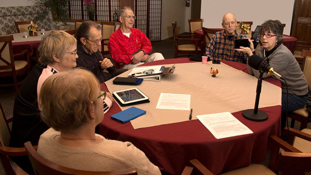 Dietrich Schultz and Johnnie Mullin (right) lead a computer class for residents in a Eugene, Oregon, retirement community.