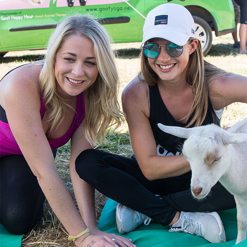 Goat Yoga: Participants enjoy petting the goats before, during and after class. Better Living Health Wellness