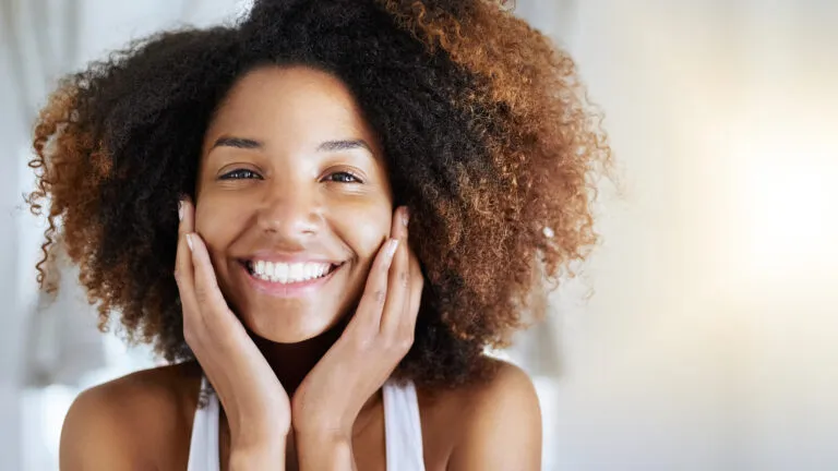 A smiling young woman takes a positive view on life