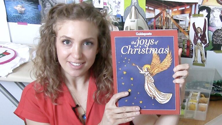 Ebroider artist Sarah Cline poses with a copy of Guideposts' The Joys of Christmas 2017