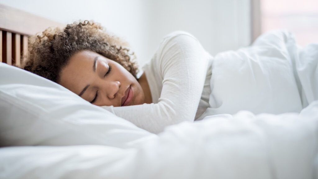An African-American woman catching up on beauty sleep.