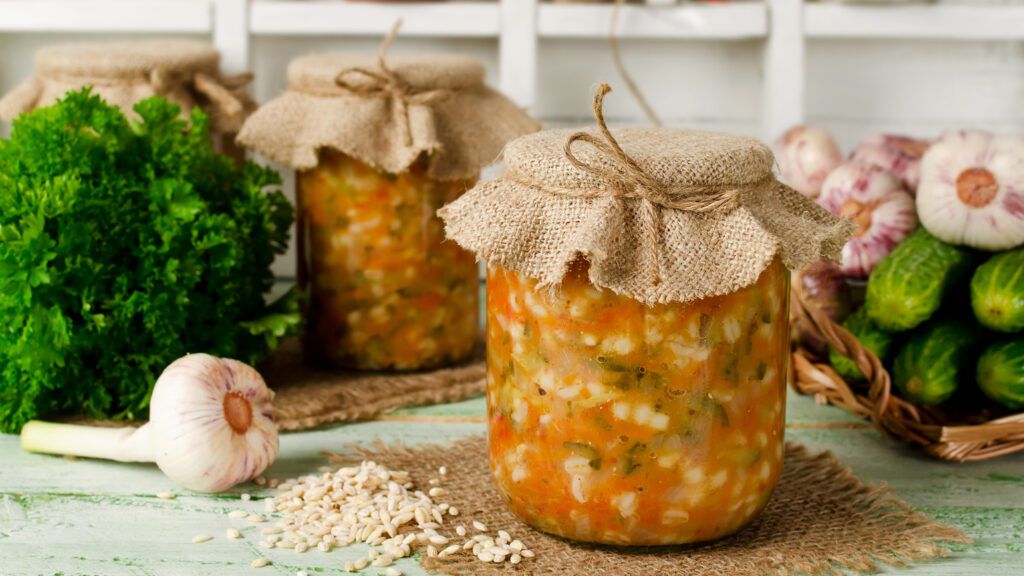 Mason jars for barley and vegetable soup with some ingredients used.