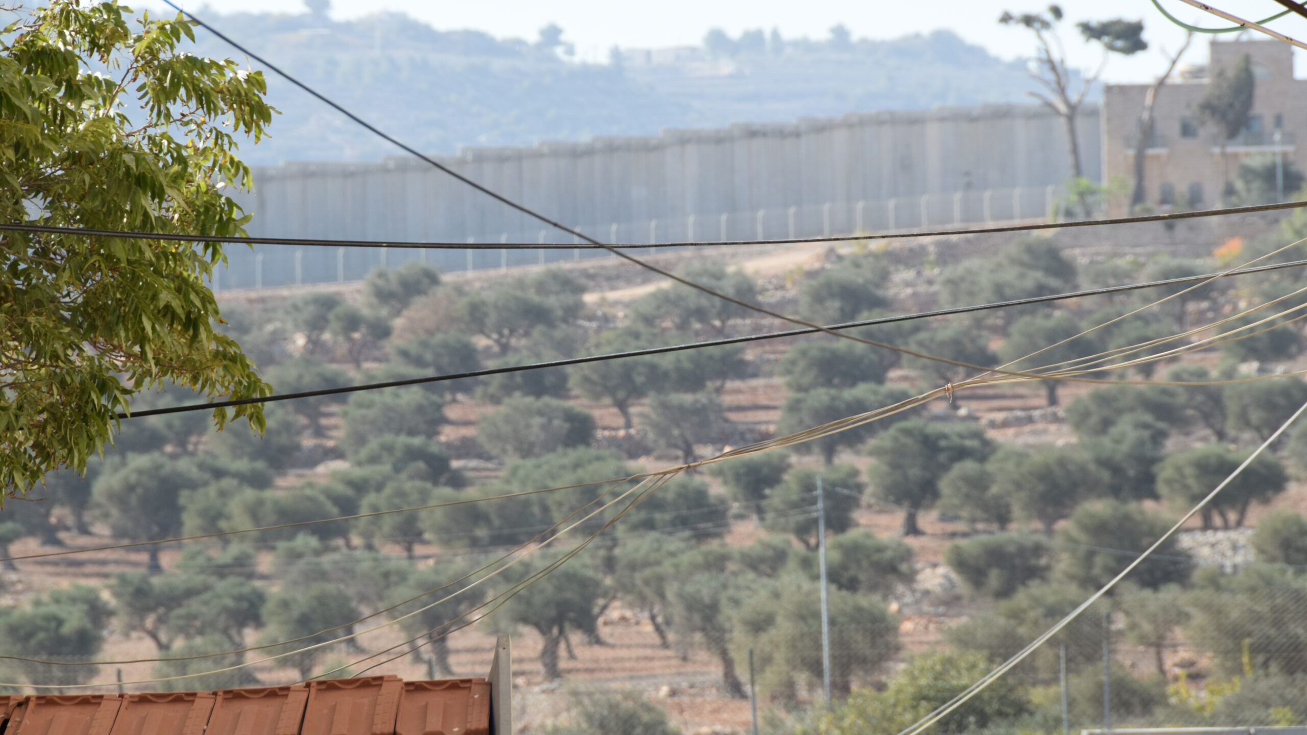 Behind the border wall in Bethlehem, Palestine, Photo credit: Brooke Obie