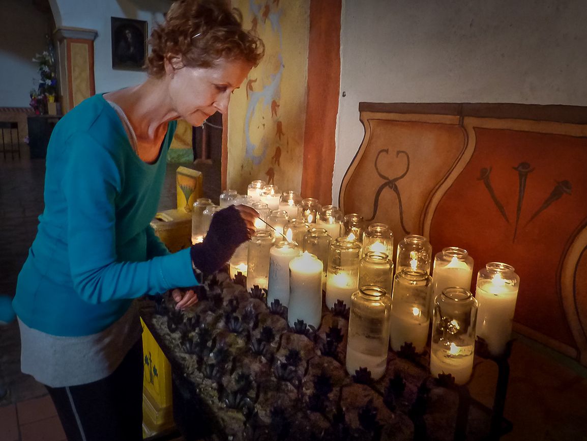 Day 45: Edie lights a candle at Mission San Juan Bautista after traveling nearly 14 miles from Salinas.