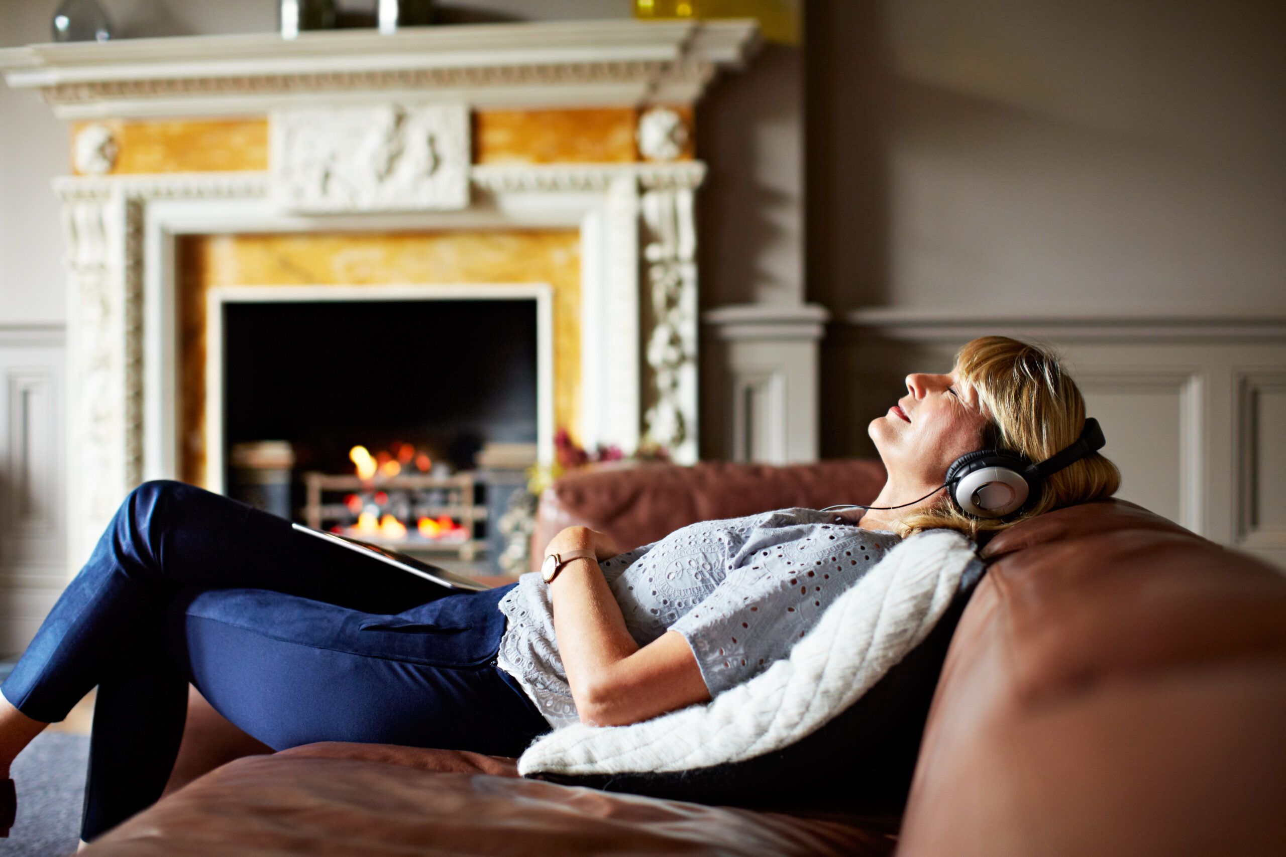 Woman relaxing, listening to music