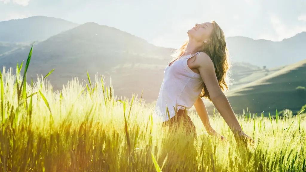 Joyful woman in a field