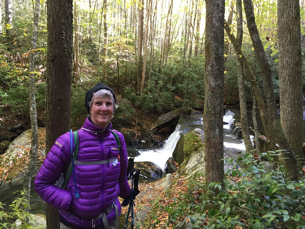 Jo-Anne pauses by a small waterfall in a stream in the Great Smoky Mountains National Park, America's most visited national park.