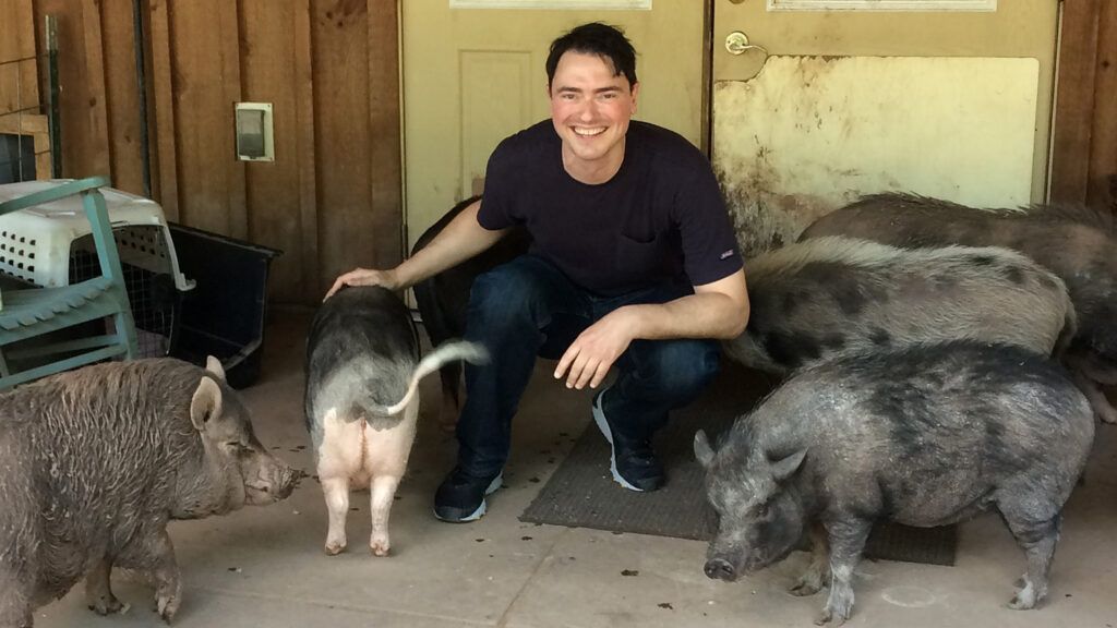 Doug poses with some porcine pals